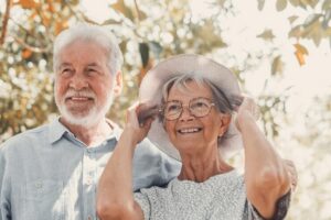elderly couple embracing spring park outdoors having fun enjoying together looking trees two old mature people love caring each otherxa 516988 2430