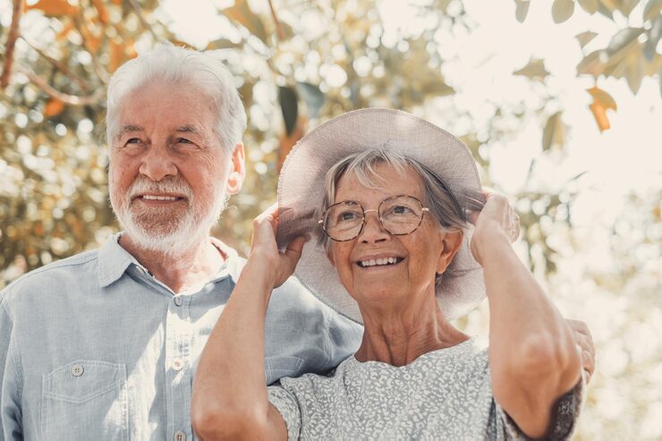 elderly couple embracing spring park outdoors having fun enjoying together looking trees two old mature people love caring each otherxa 516988 2430